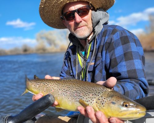 Successful trout catch while fishing the Rio Grande River in Colorado